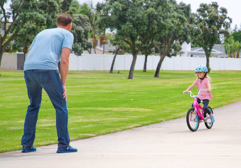 teaching child to pedal a bike
