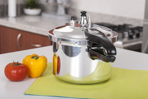 double handle pressure cooker with vegetables