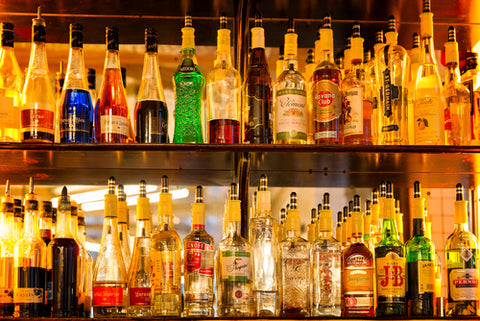 liquor shelf with multiple types of booze