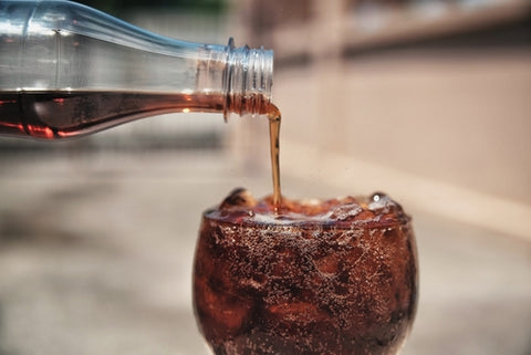 soda poured into liquor glass