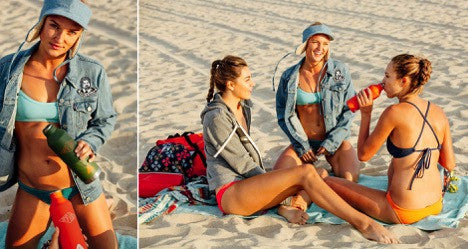 Young women in bikinis and sweatshirts enjoy an afternoon on the beach while wearing clothing from Jolyn and listening to the Float Bluetooth speaker from H2O Audio. 