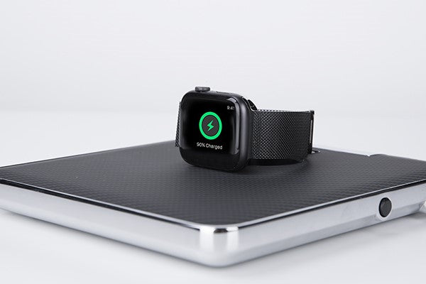 vertical Apple Watch on a wireless charger