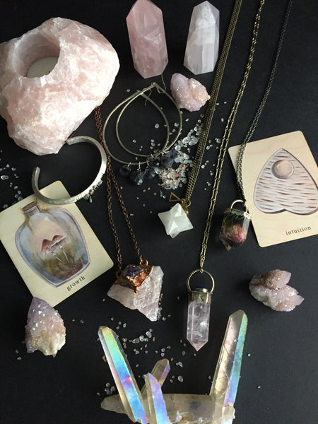 Portland Local Morgaine Faye Rose Quartz Crystal Point Necklace with Lapis Lazuli, Bones N Things False Rose Quartz Necklace, Crystal Vision Gems' Rose Quartz and Amethyst Copper Necklace, NUCULT Acension Stone Opalite Necklace, Pigeon Heart Earrings Altar PDX Gothic Jewelry  