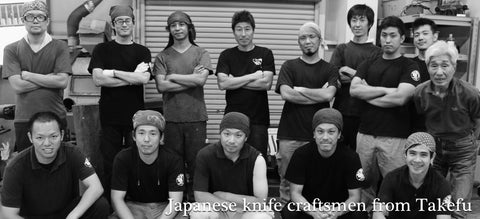 Photo of several bladesmiths and knife makers from Takefu, Japan lined up and posing for the camera.