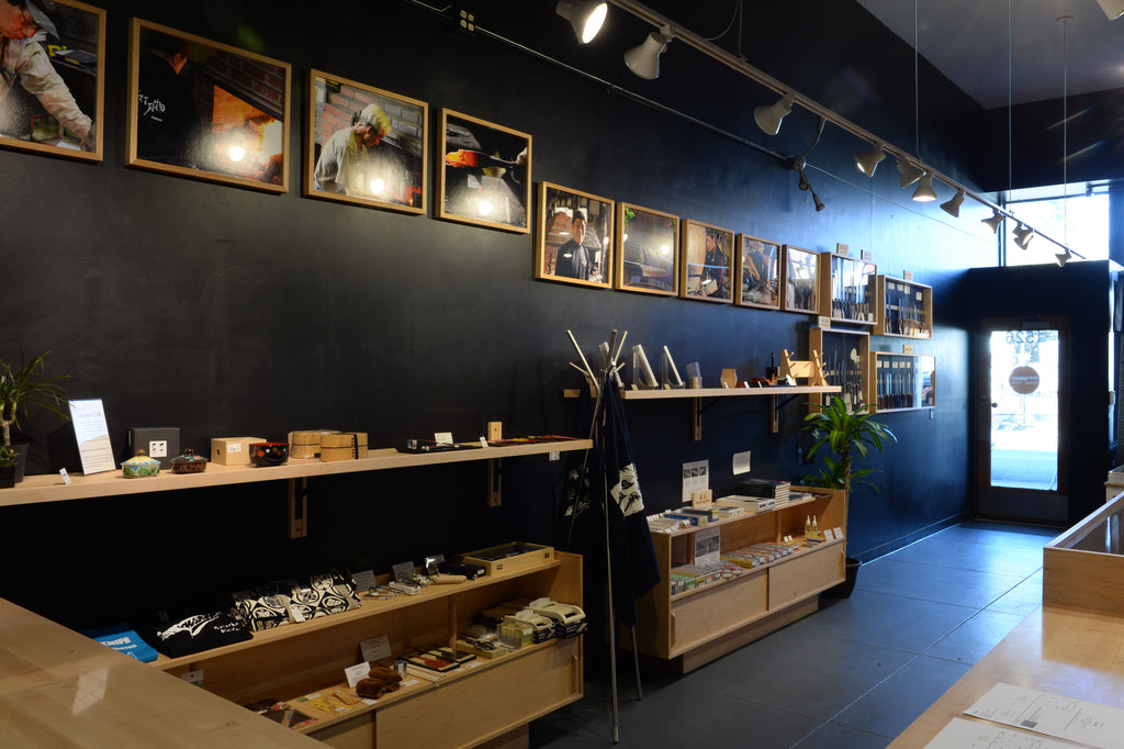 A photo of the Seisuke Knife Portland shop interior, specifically of shelves displaying knife accessories.