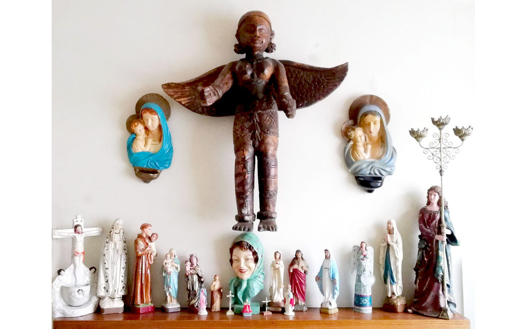 Hazel's Eclectic mantle piece, with religious icons and statues  - Inkabilly Blog House Tour