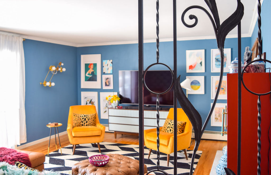 House Tour: Ariel’s bold retro home - Lounge wide shot through railings.Photo credit PMQforTWO