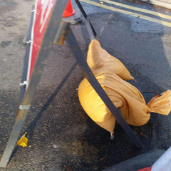 Sandbag used for weight on road sign