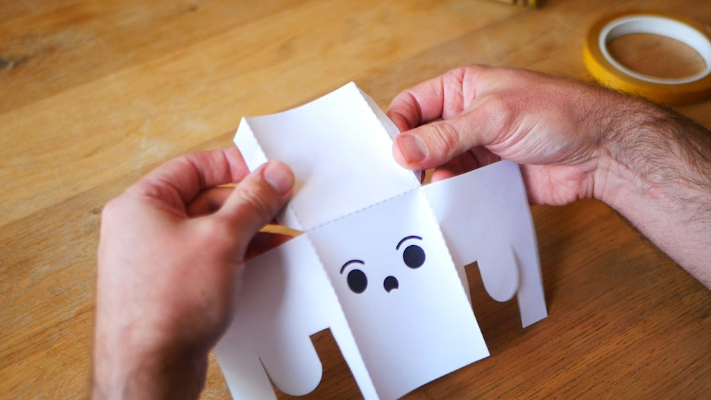 Photo of a partially folded paper ghost