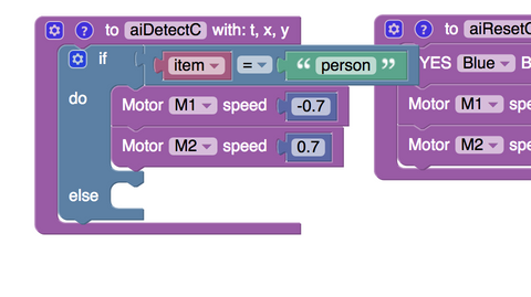 Adding motor blocks to make Smartibot reverse if the A.I. sees a person