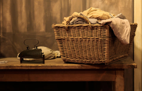 Wicker laundry basket with antique iron