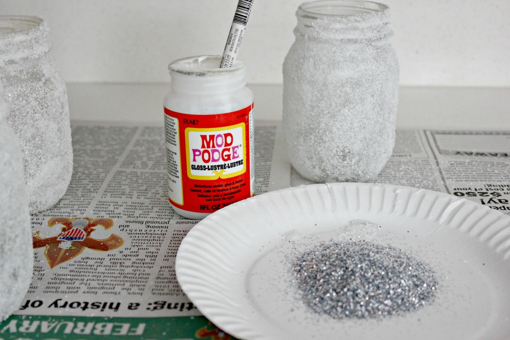 Place the glitter for the Epsom salt luminaries on a paper plate