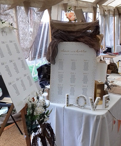 Wedding seating table plan on easel Connie & Joan at wedding fair