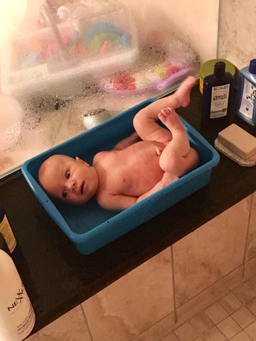 Baby in a toy sink