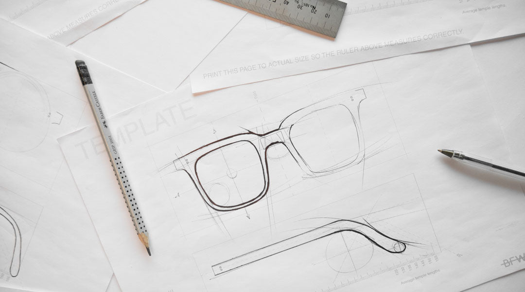 A sketch of a sunglasses frame on white paper