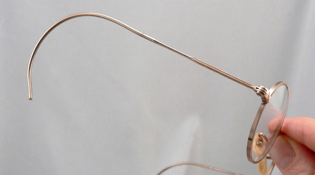 Glasses frame with curl side temples