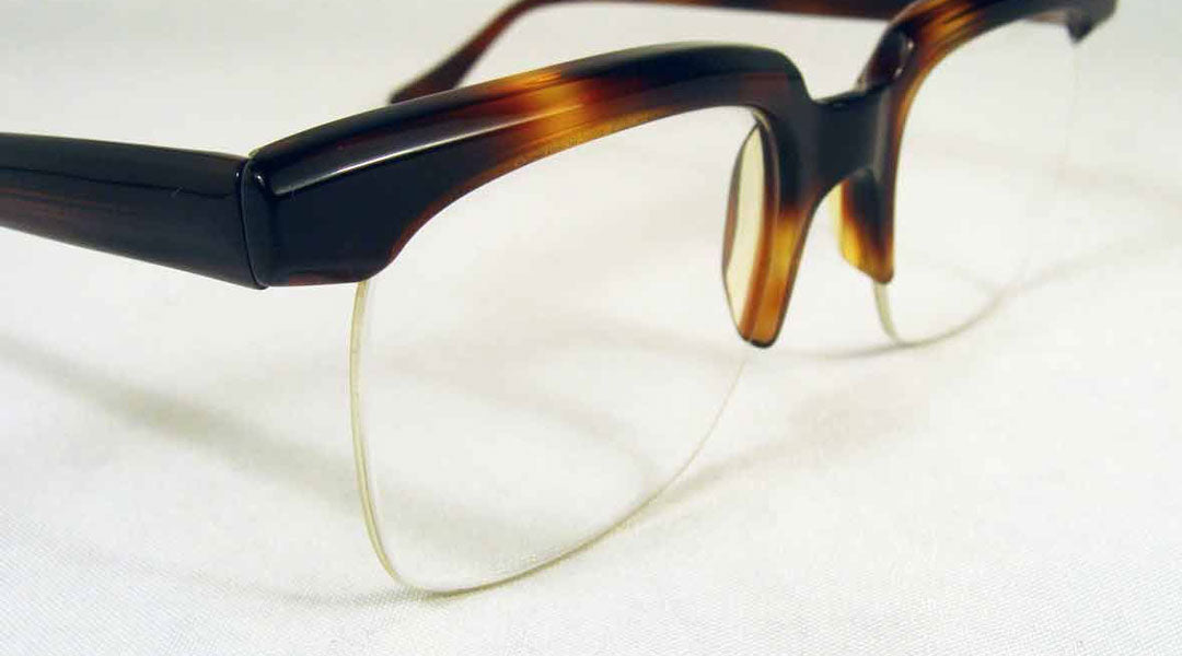 Half rim glasses that use a nylon Supra chord to hold the lenses