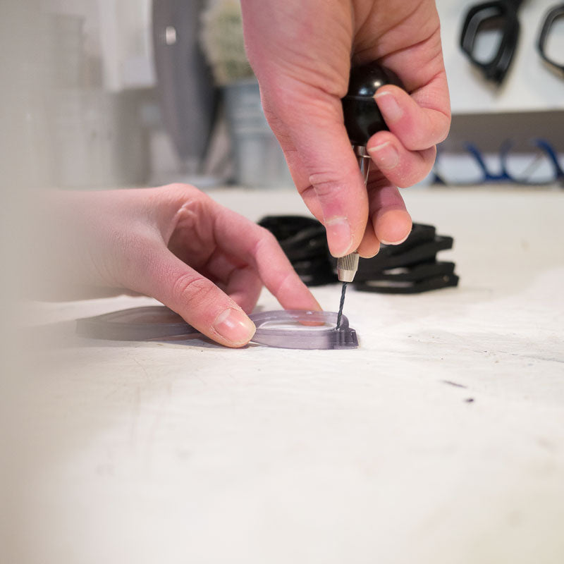 Hand-drilling-glasses-frames-in-our-workshop