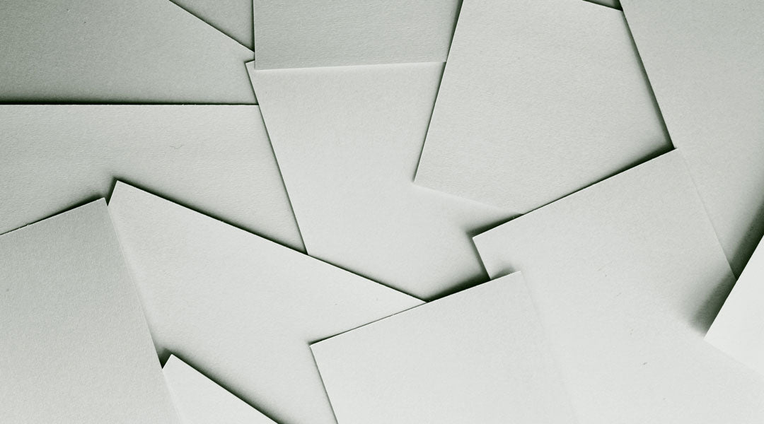Scattered sheets of blank white paper