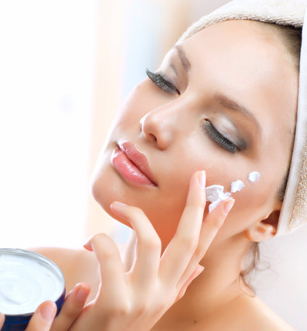 Woman using the best anti-aging skin care products