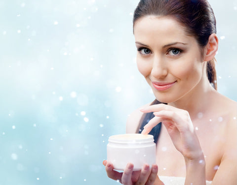 Woman using the best anti-aging skin care products