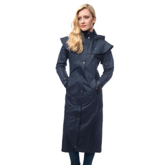 Lighthouse Womens Outback Full Length Waterproof Raincoat in Navy. Zipped and buttoned. Hands in pockets.