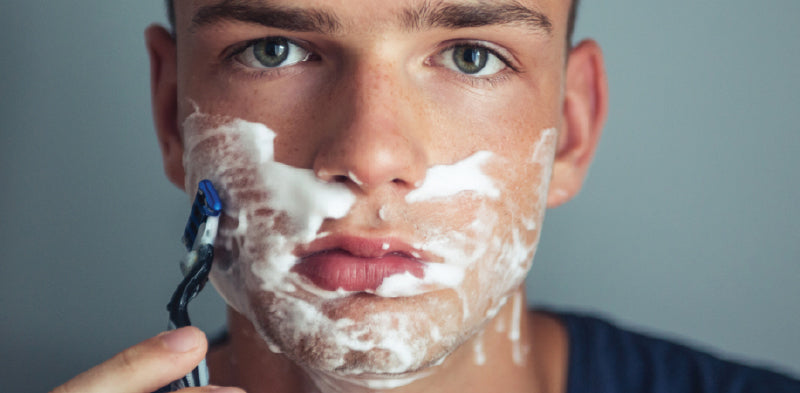 young teenager shaving
