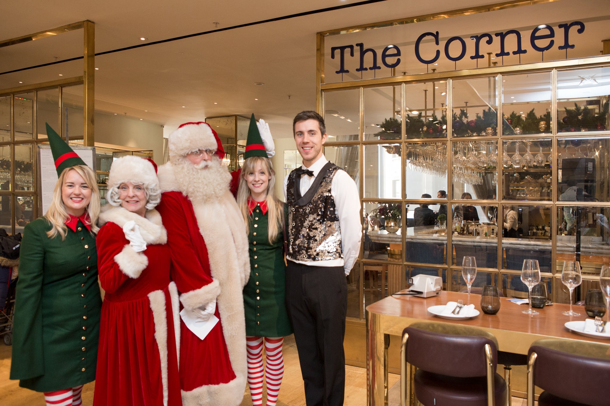 Santa and Mrs Claus in Selfridges with the elves