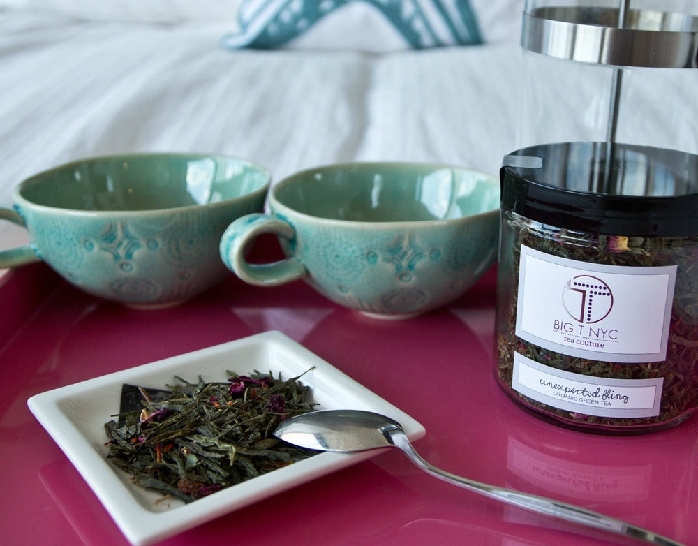 Big T NYC unexpected Fling organic Sencha green tea loose leaf on bed with anthropologie tea cups and pottery barn serving tray