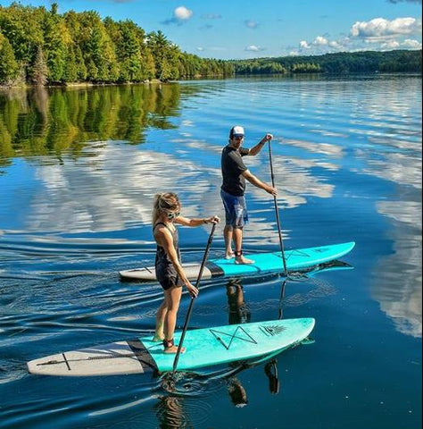 Cruiser SUP Escape and paddle boarding on a lake