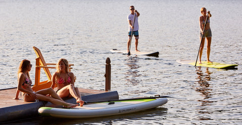 Stand Up Paddle Boarders Enjoying Their Sport