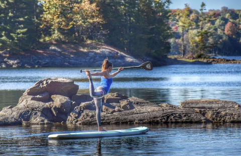 Stand Up Paddle Boarder holding Carbon paddle