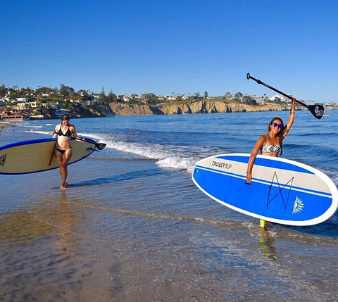 stand up paddle boarder carrying Cruiser Eco Dura-Maxx