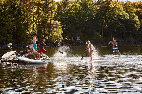A Large Family Stand Up Paddle Boarding