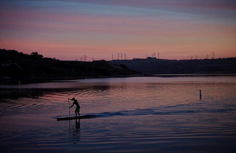 Stand Up Paddle Boarder in calm water