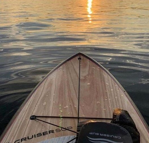 stand up paddle boarding in the shade