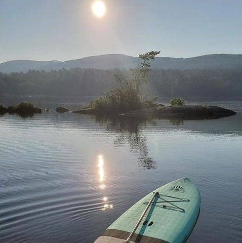A stand up paddle board on a lake