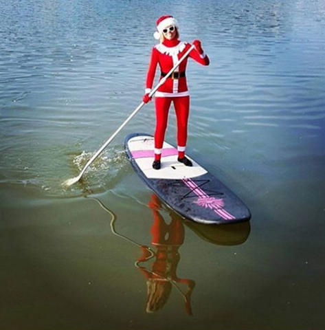 Paddle Boarder Dressed as Santa