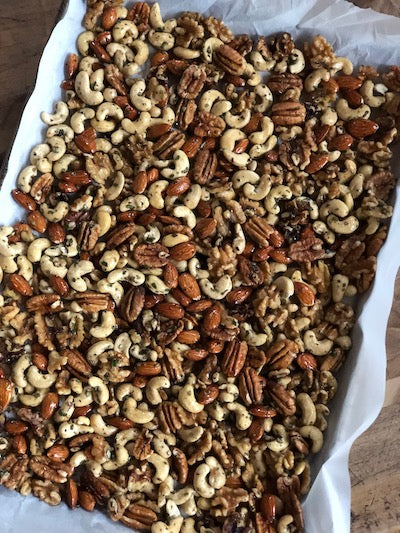 mixed nut mixture on baking pan