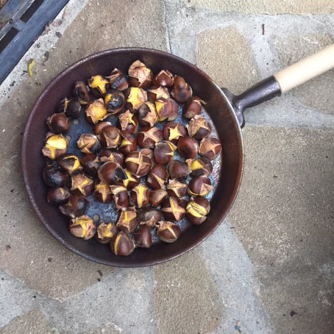 Tuscan Style Home Décor: A Guide The 5 Main Things to Know - When in season, I always buy roasted chestnuts from the vendors. An Italian friend recently taught me how to roast them properly on an open fire. (this is the pan of chestnuts I roasted)