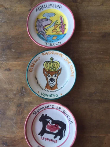 collection of buon ricordo plates from Italy