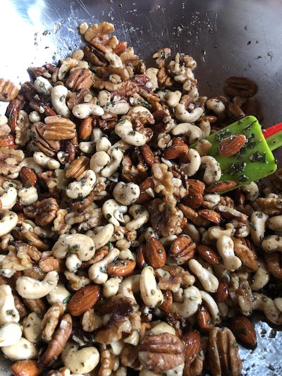 mixing nuts in bowl with ingredients