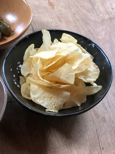 potato chips in a small bowl and served as an aperitivo snack