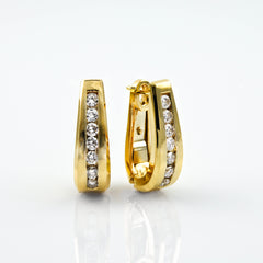 Diamond earrings set in yellow gold