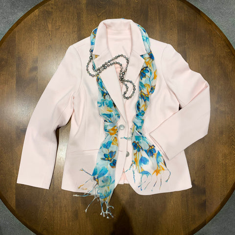 Tahitian pearls have an iridescent surface that reflects color, like the pink of this jacket.