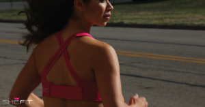 Woman jogging in the Shefit Ultimate Sports Bra