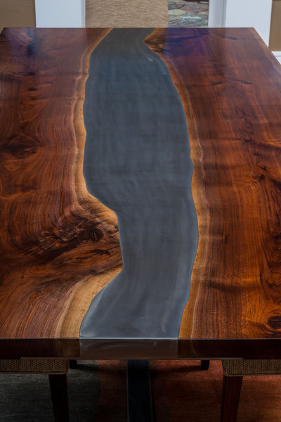 See how the steel follows the natural grain lines of the Black Walnut slabs - TerraSteel Furniture Design, LLC - Bend, OR