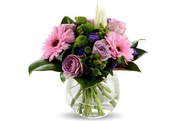 Pastel coloured posy with seasonal flowers and foliage.