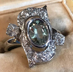 green sapphire in antique white gold and diamond engagement setting