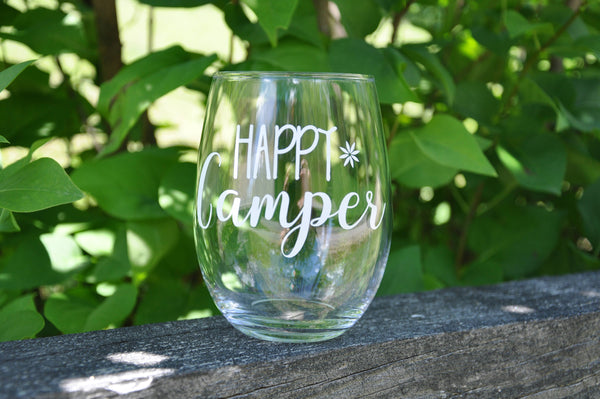 Gin glass that says "Happy Camping"